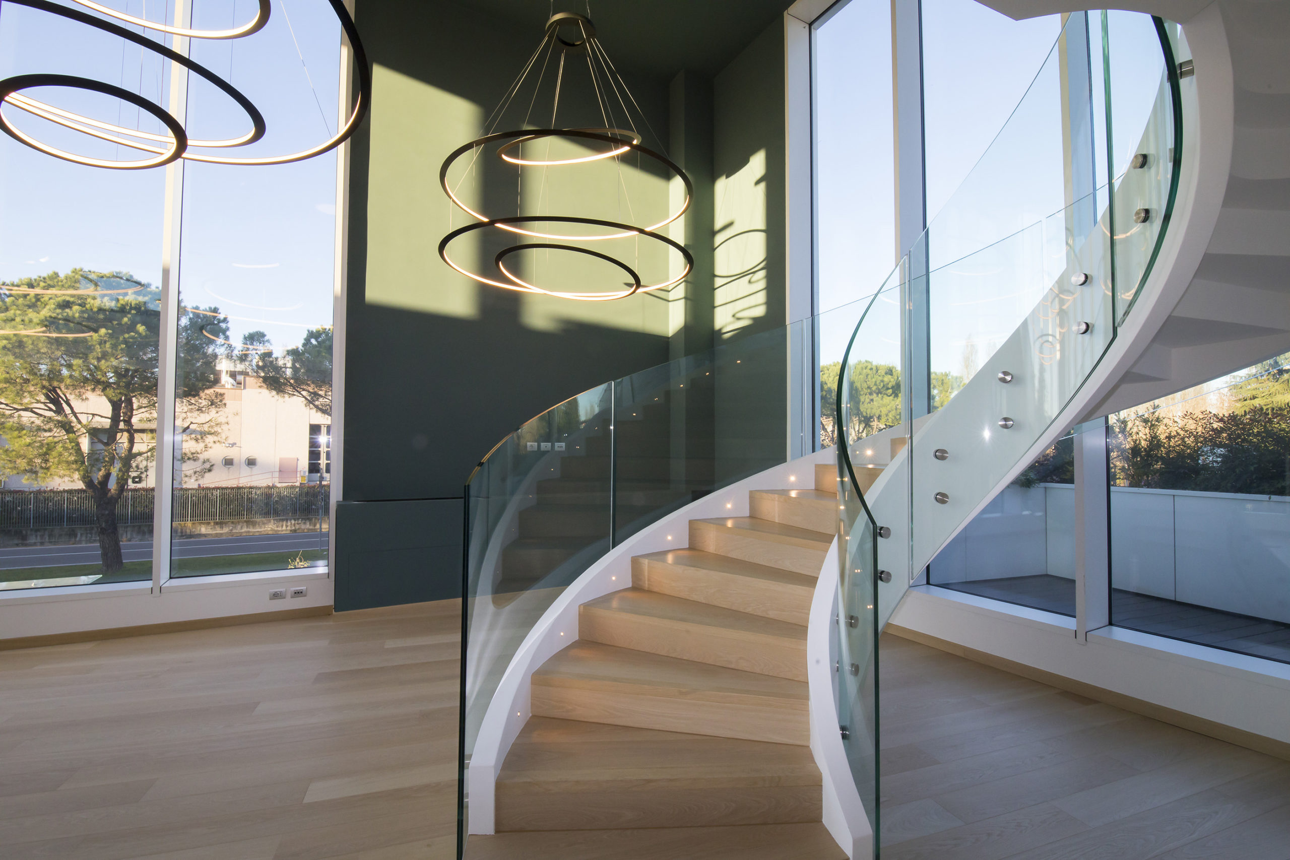 Helical Concrete Stair with Curved Glass Railing – Milan